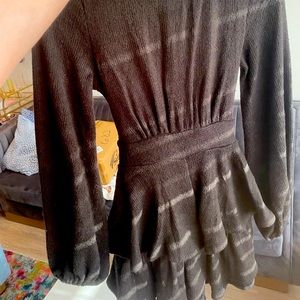 Black romper with ruffles and cute bow in the back